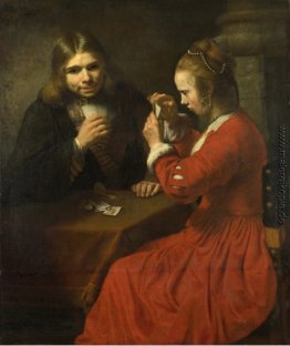 Ein junger Mann und ein Mädchen spielen Karten