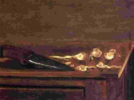Knoblauchzehen und Messer auf der Ecke einer Tabelle