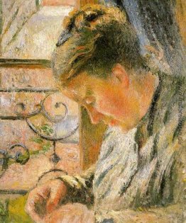 Porträt von Madame Pissarro Nähen der Nähe eines Fensters