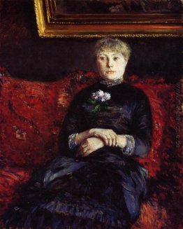 Frau sitzt auf einem roten Sofa Flowered